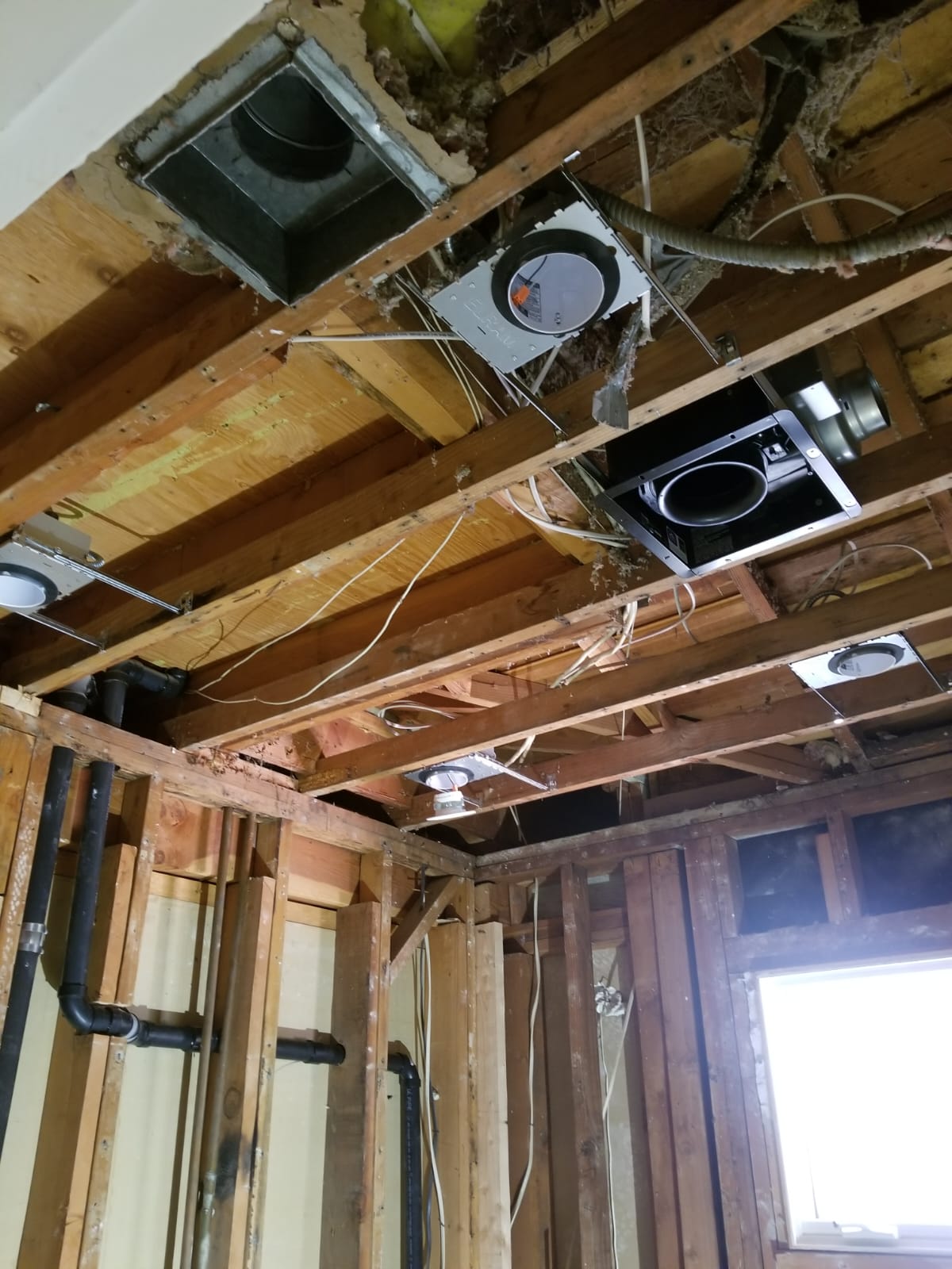 Bathroom Ceiling Rough In Lights And Fan — INE Electrical Service job photo