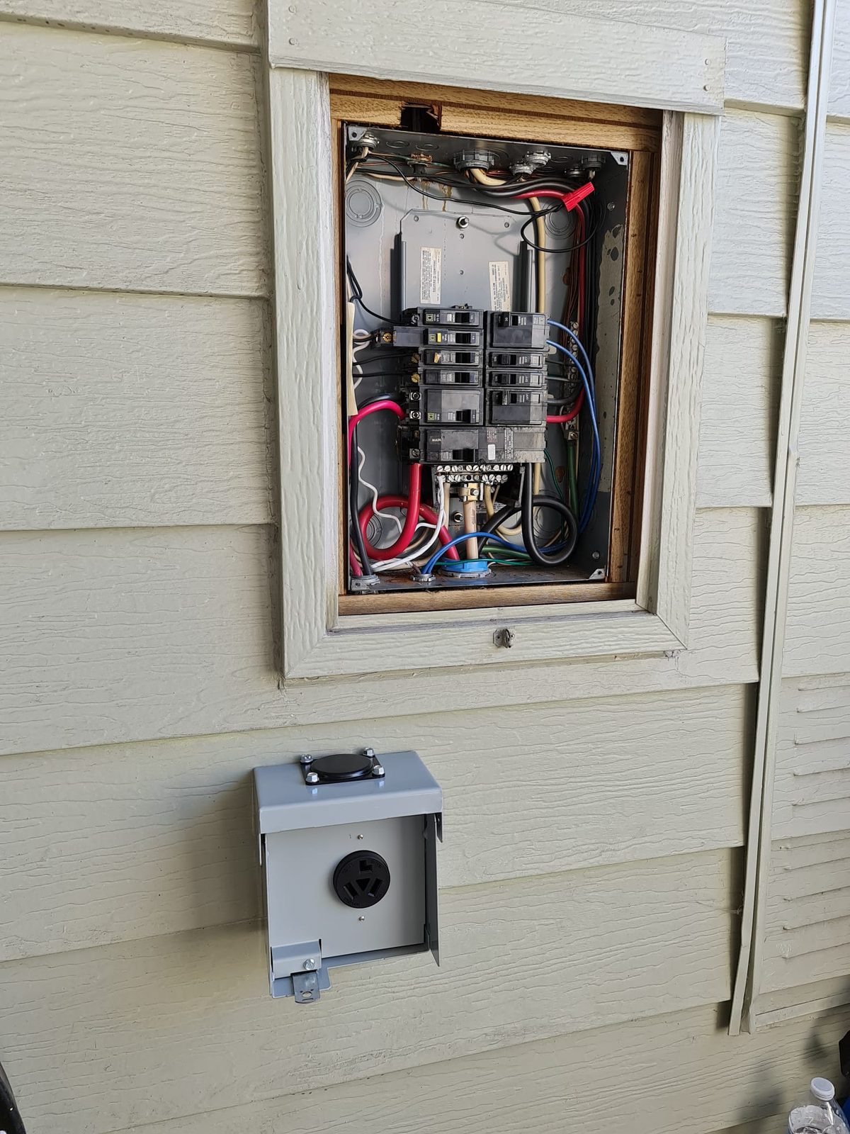 Ev Charging Outlet Below Exterior Panel — INE Electrical Service job photo