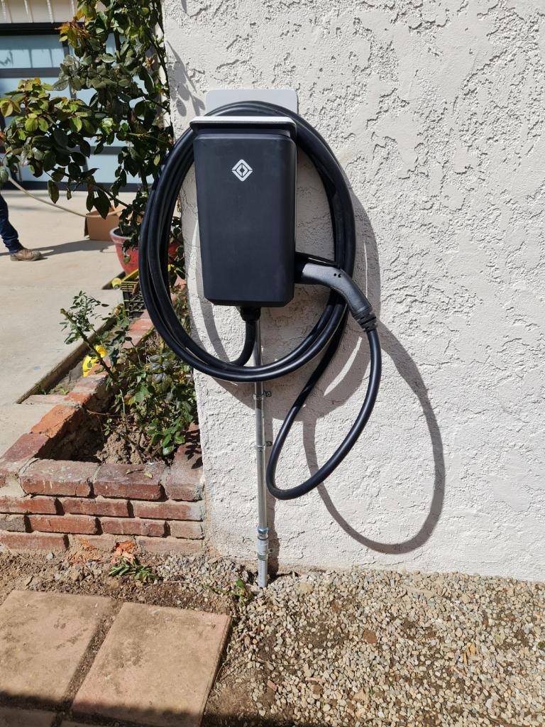 Rivian Wall Charger On Stucco Wall — INE Electrical Service job photo