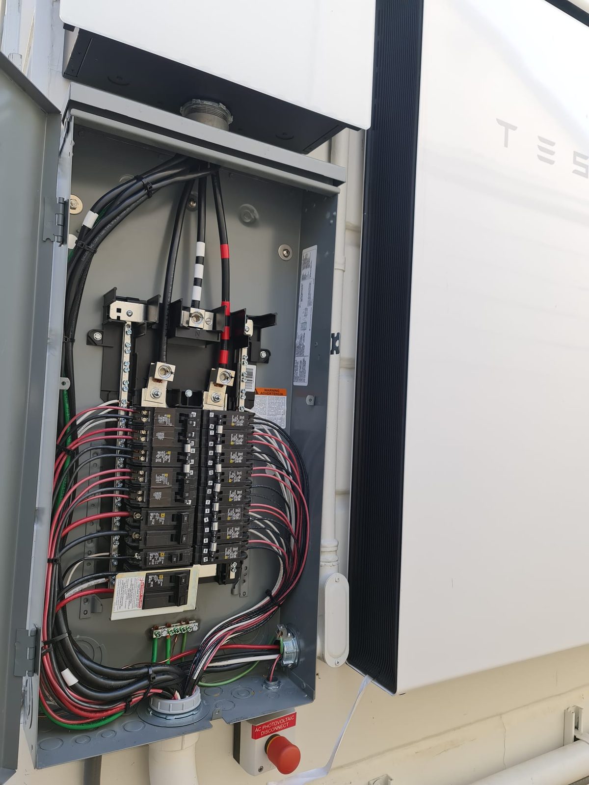Subpanel Beside Tesla Battery Backup — INE Electrical Service job photo