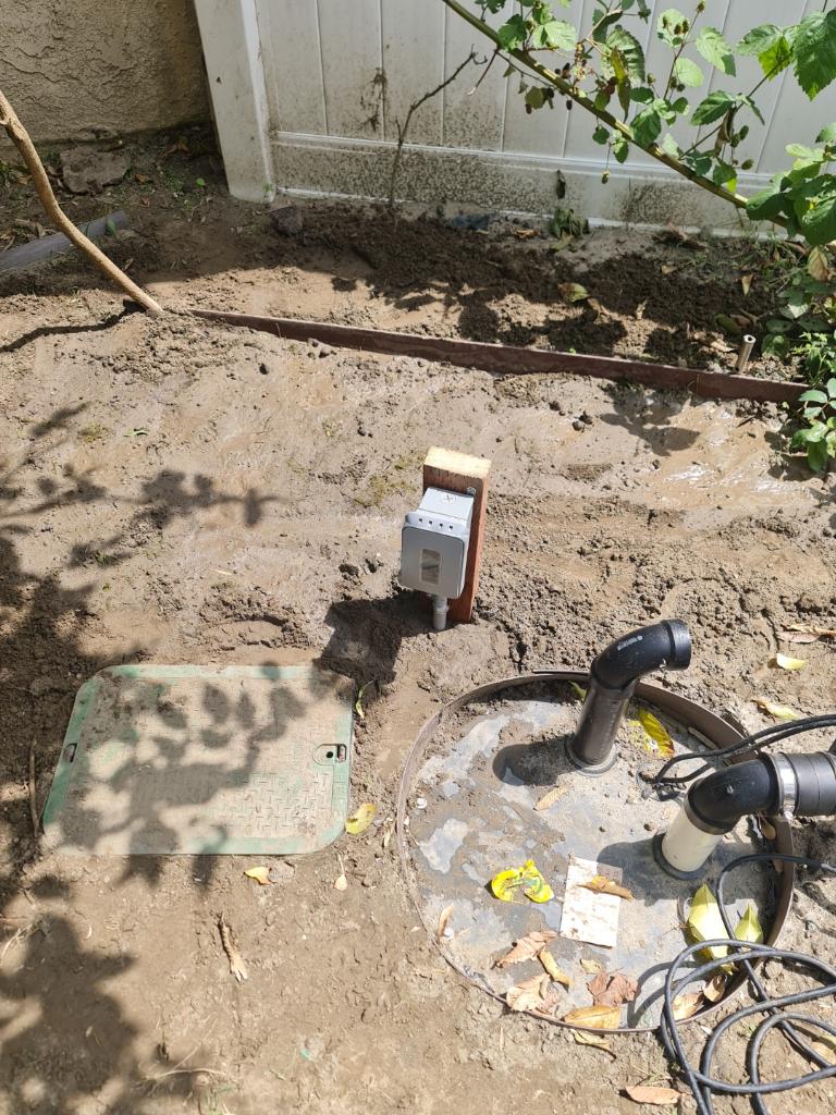 Sump Pump Weatherproof Outlet In Yard — INE Electrical Service job photo