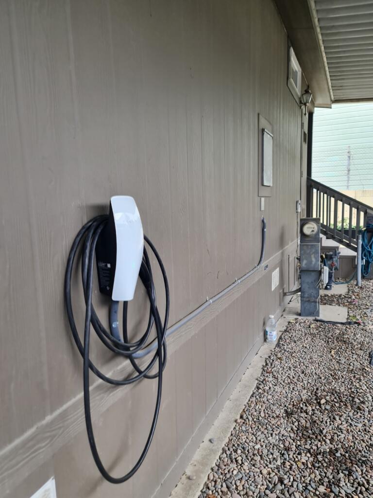 Tesla Wall Connector On House Exterior — INE Electrical Service job photo