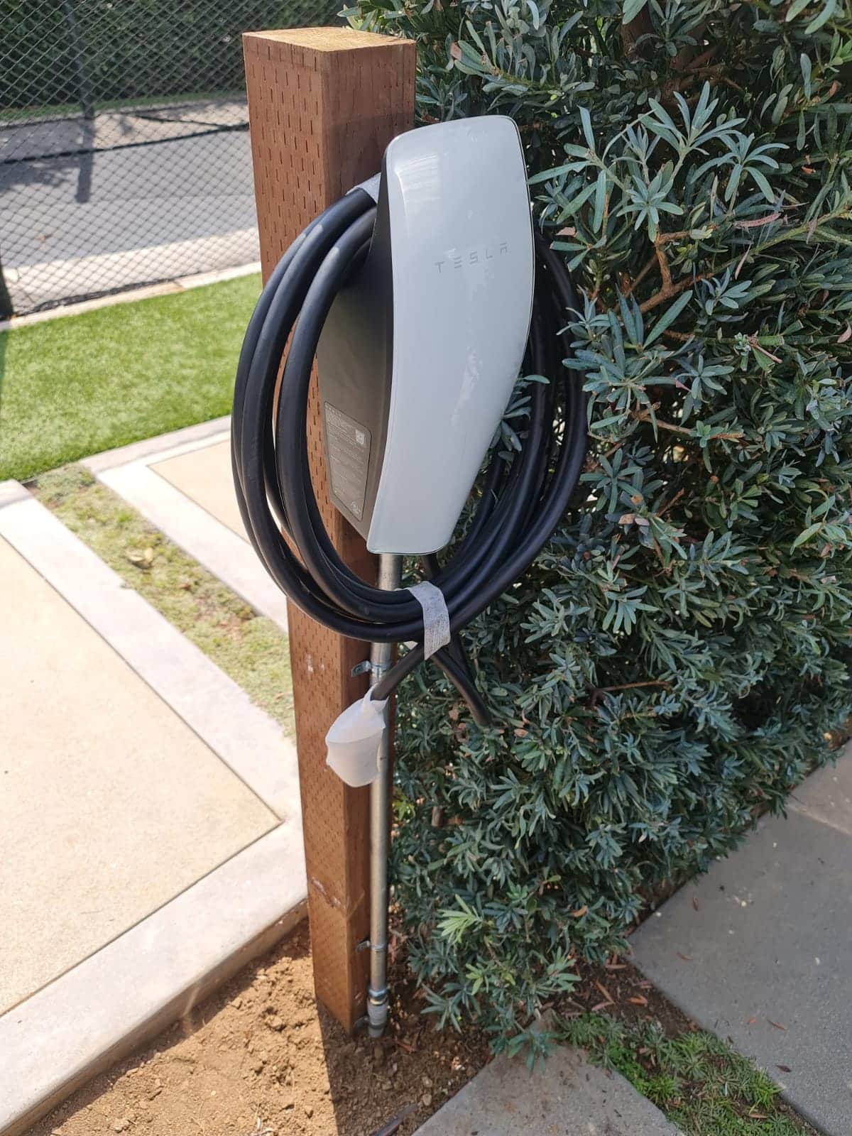 Tesla Wall Connector On Wood Post — INE Electrical Service job photo